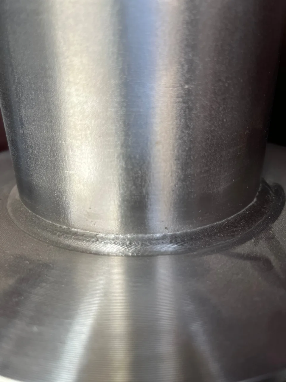 Stainless-steel weld bead detail on an RWS-produced component